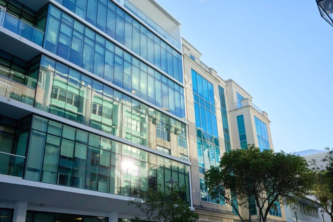 The exterior of a glass office building in Bermuda.