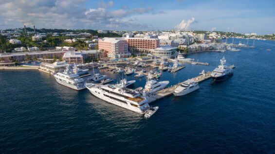 An array of ships dock in a harbor in Bermuda during the day.